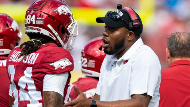 Razorbacks wide receivers coach Kenny Guiton on sidelines with Warren Thompson at Outback Bowl
